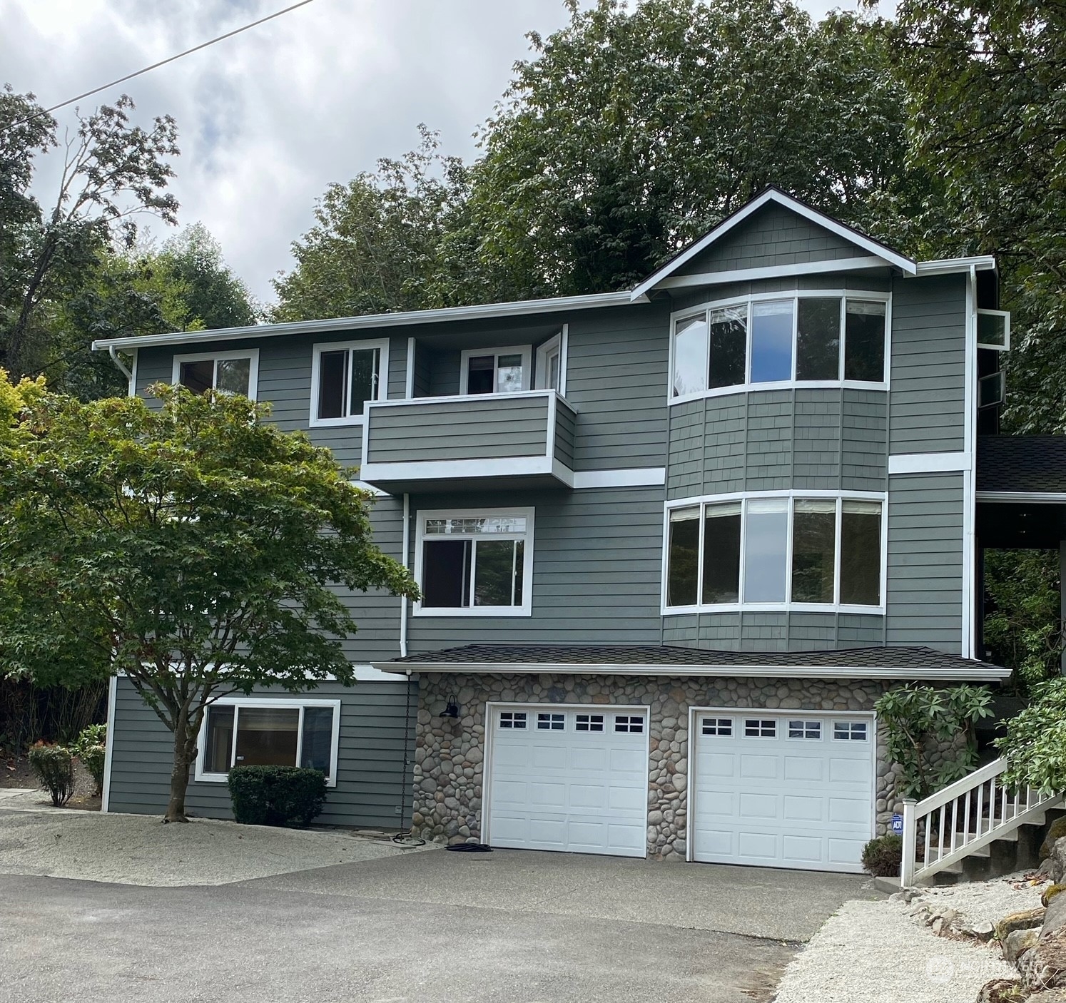 a front view of a house with a garage