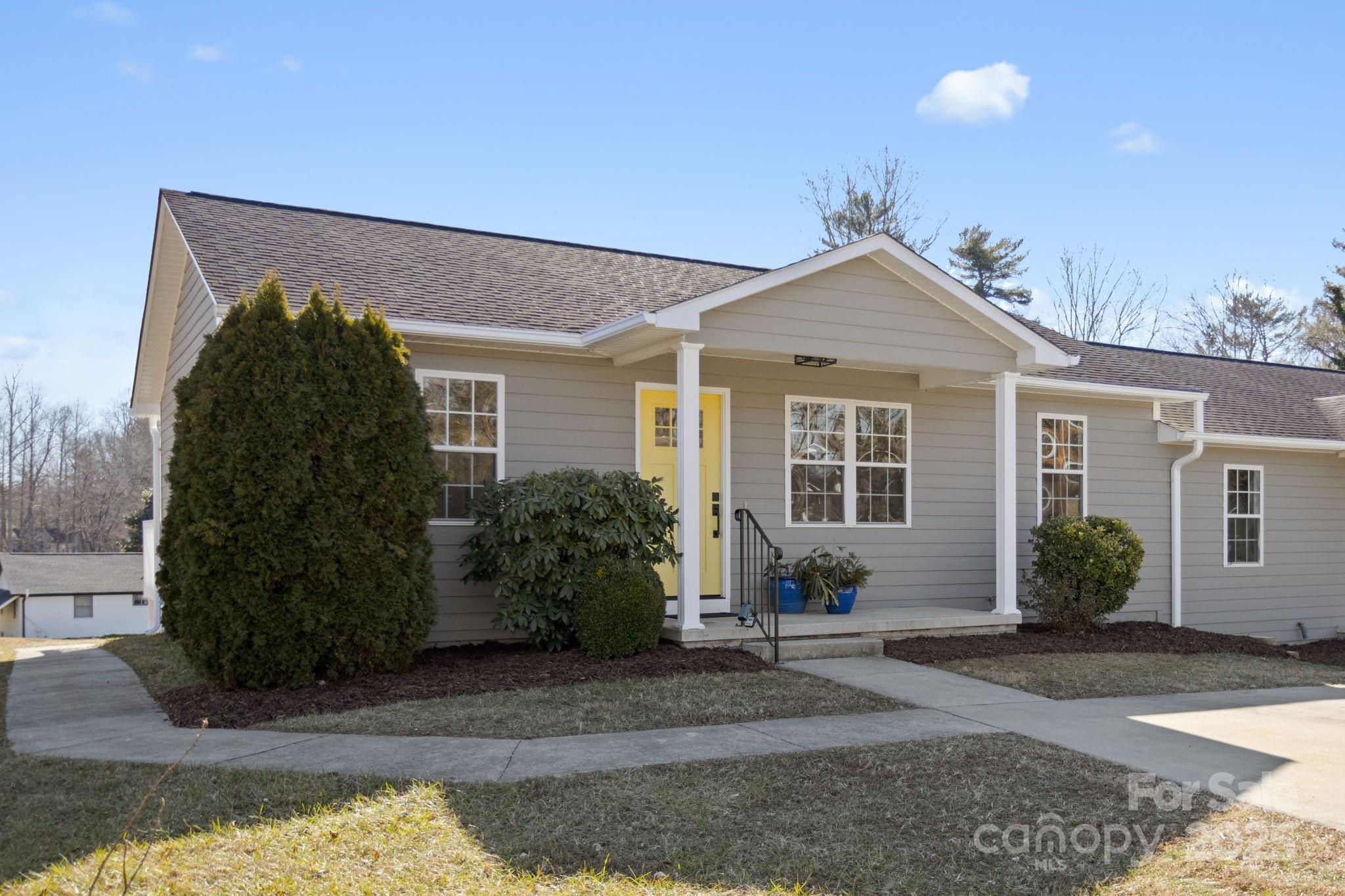 a front view of a house with garden