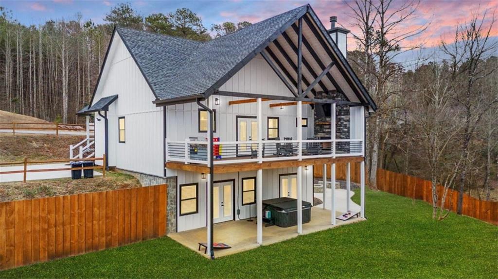 a view of a house with backyard and porch