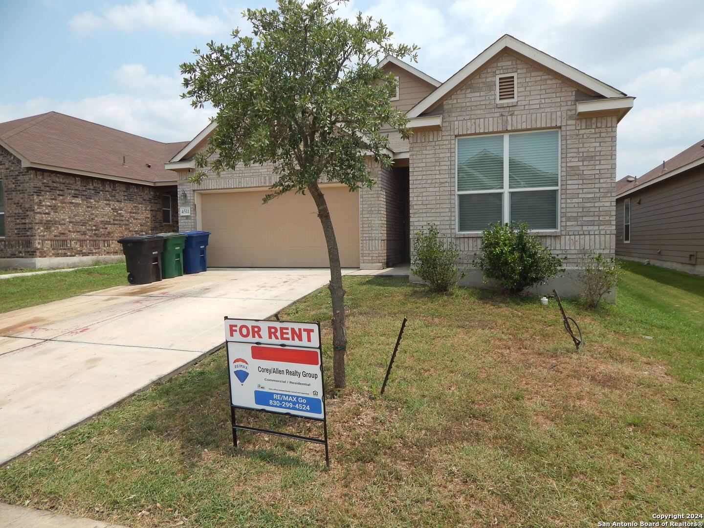 a house with yard in front of it