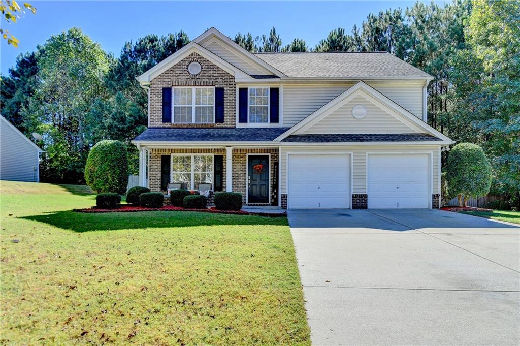 front view of a house with a yard