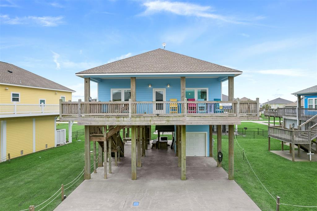 a view of house with swimming pool outdoor seating area