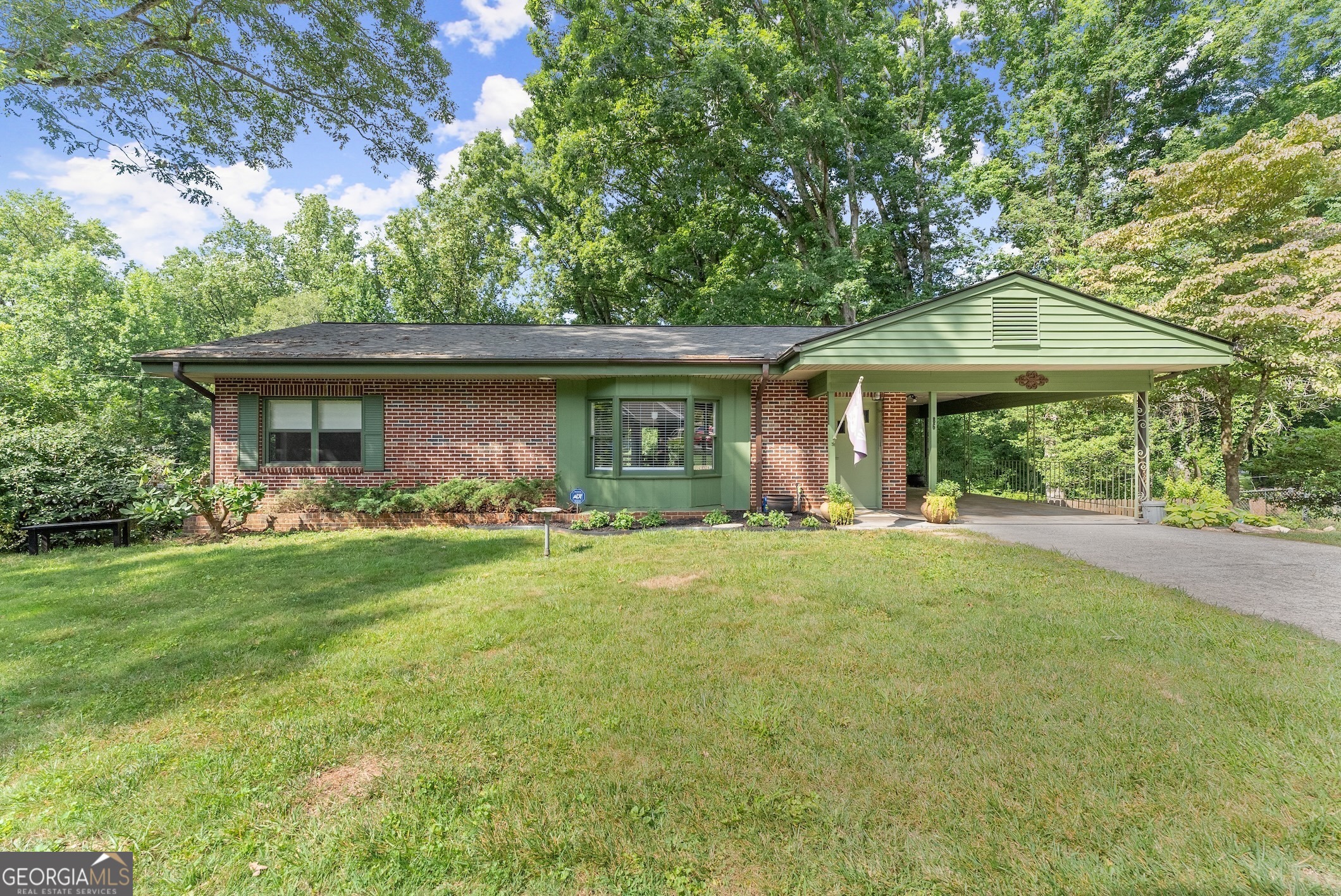 a front view of a house with yard