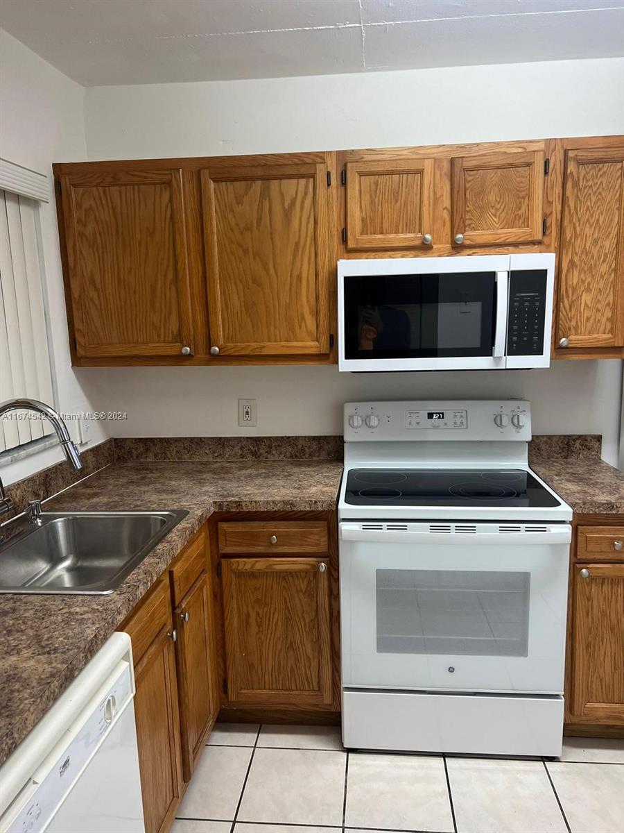 a kitchen with a stove and a sink