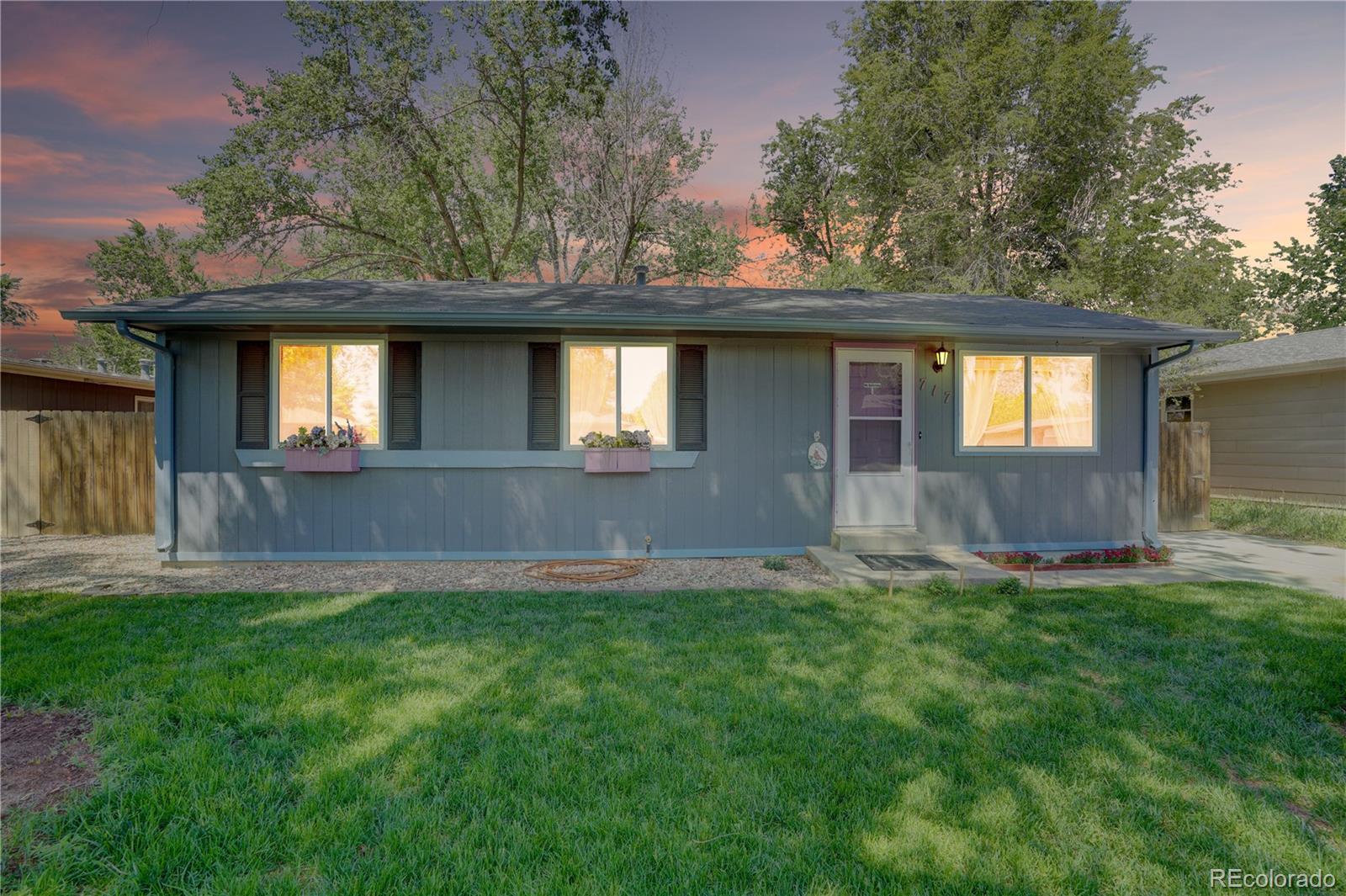 front view of a house with a yard