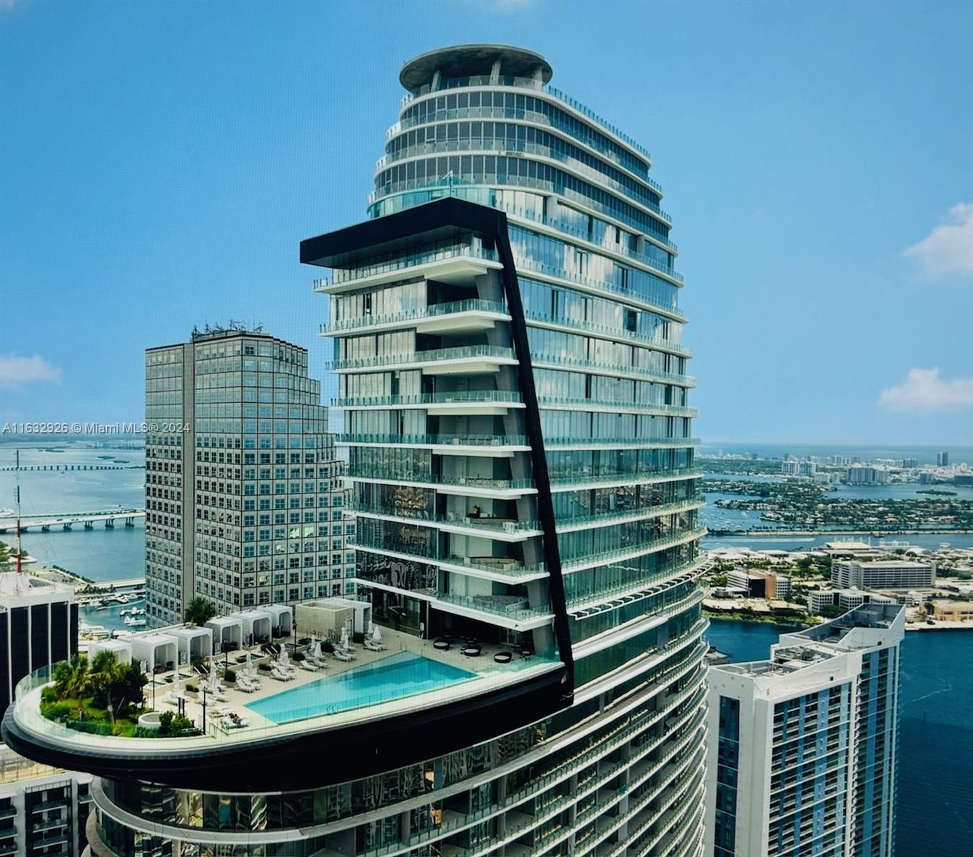 a view of a tall building from a balcony