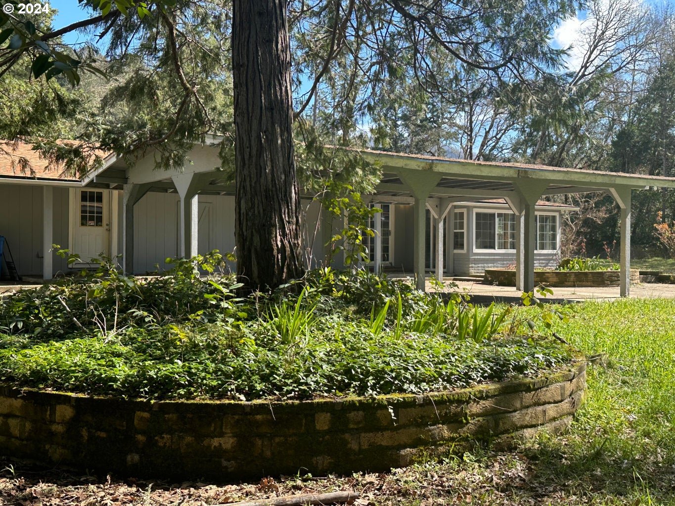 front view of a house with a garden