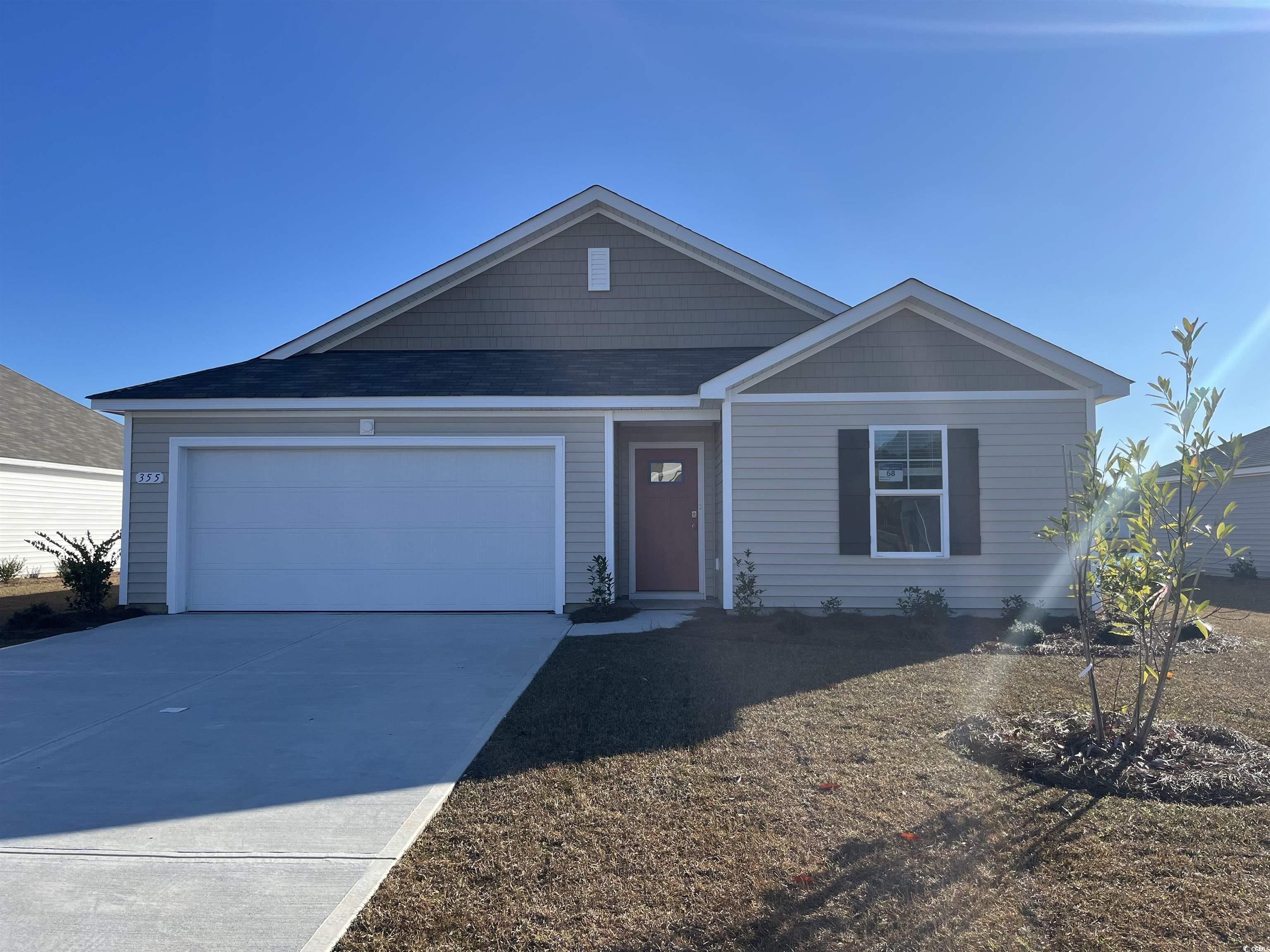 Ranch-style home featuring a garage