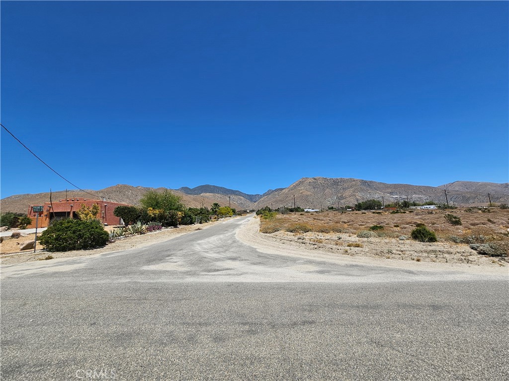 a view of a road with a ocean view