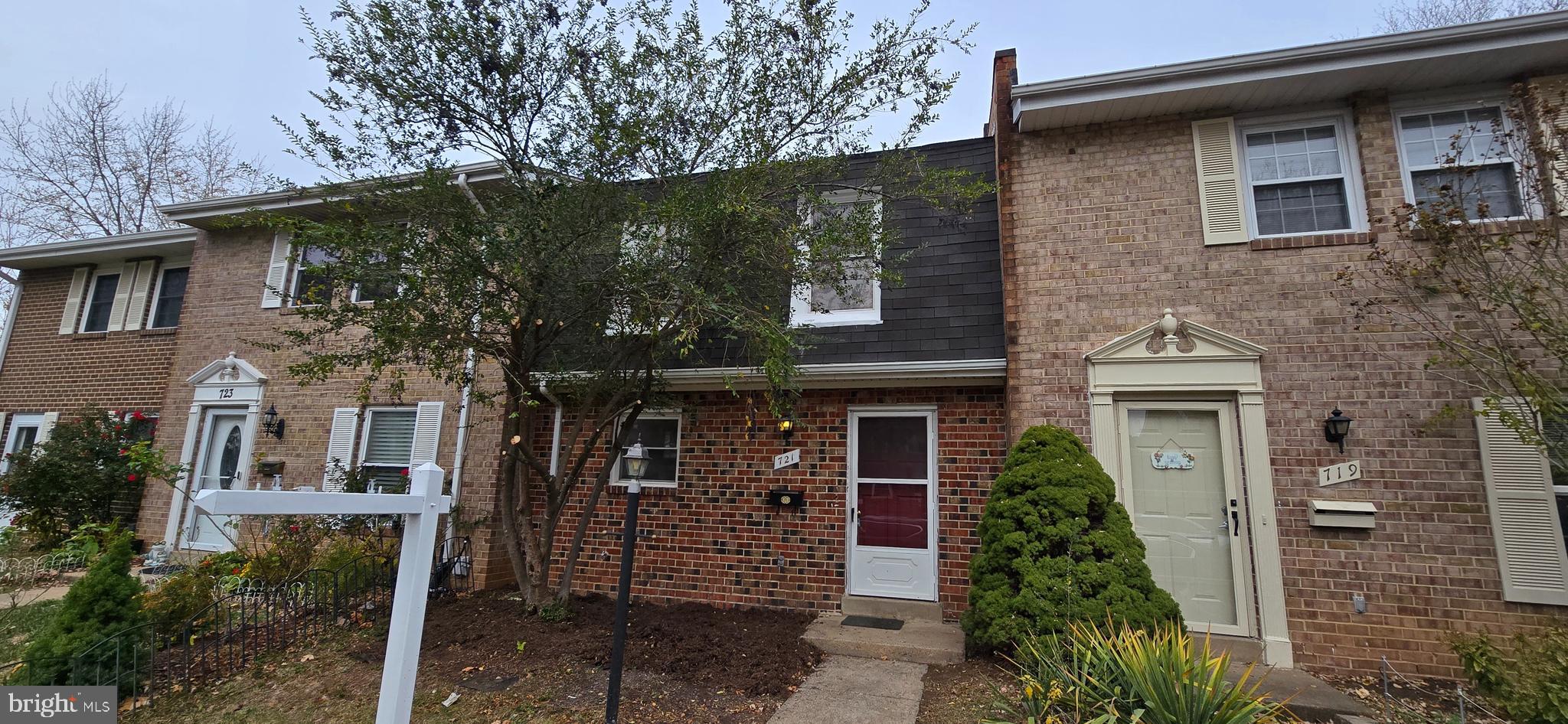 front view of a house with a garden