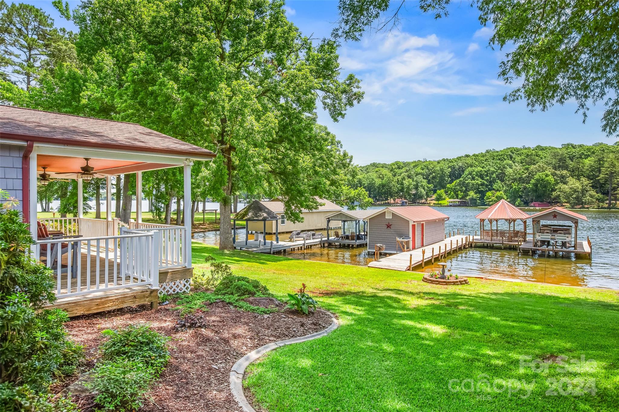 a view of a house with swimming pool and porch with furniture