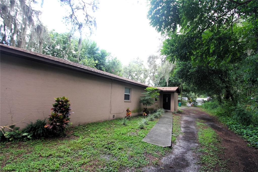 a backyard of a house with lots of green space