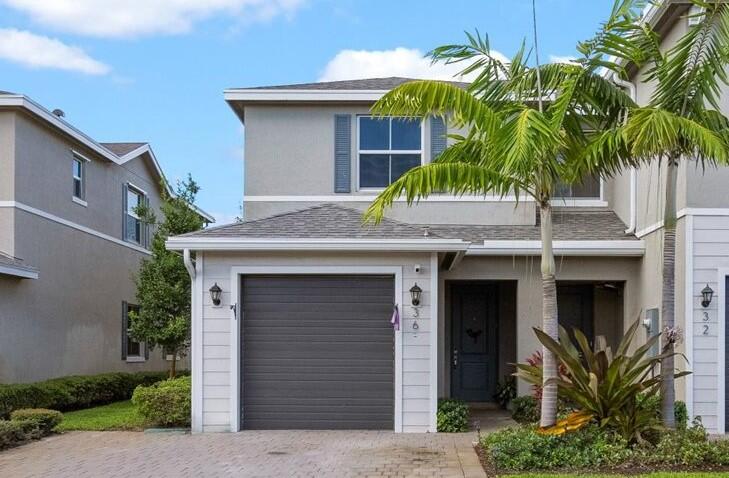 a house with a tree in front of it