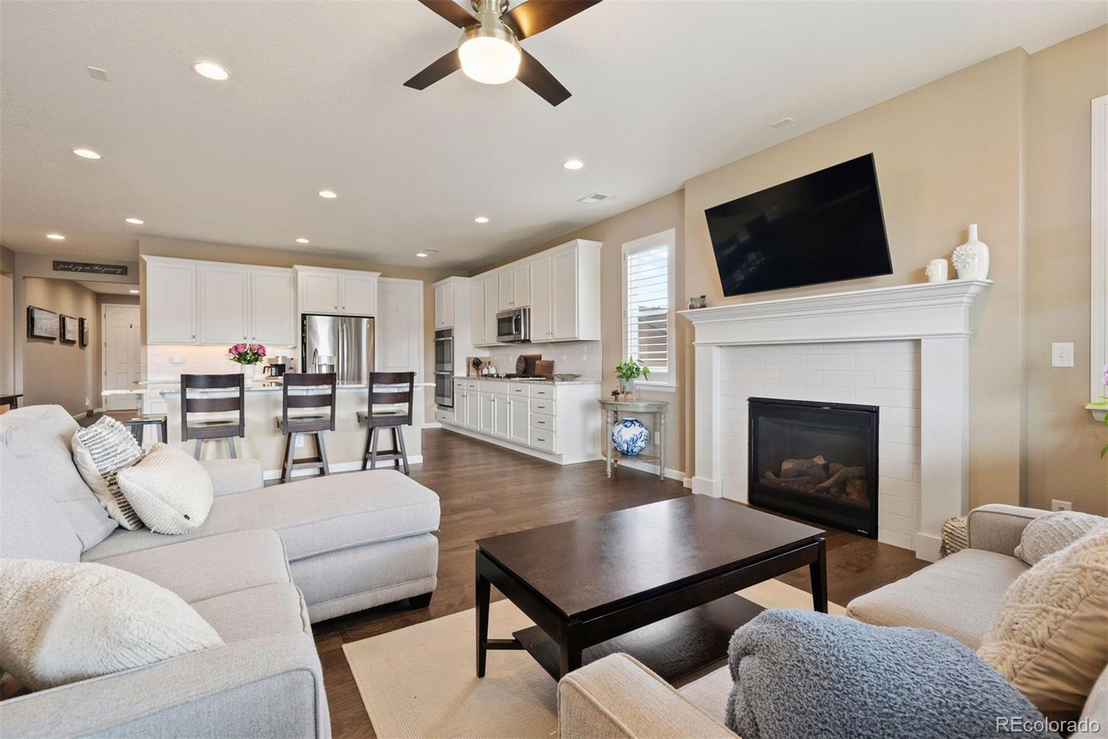 a living room with furniture fireplace and flat screen tv