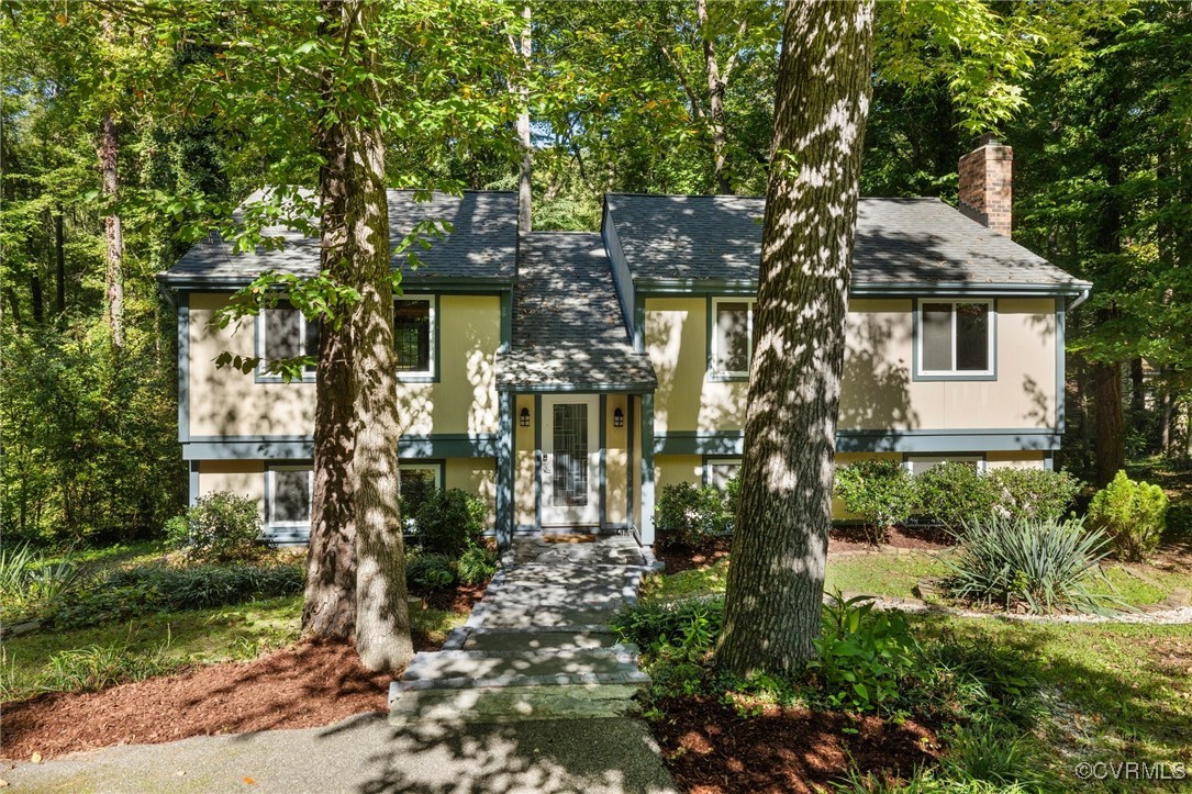 a view of a house with a tree