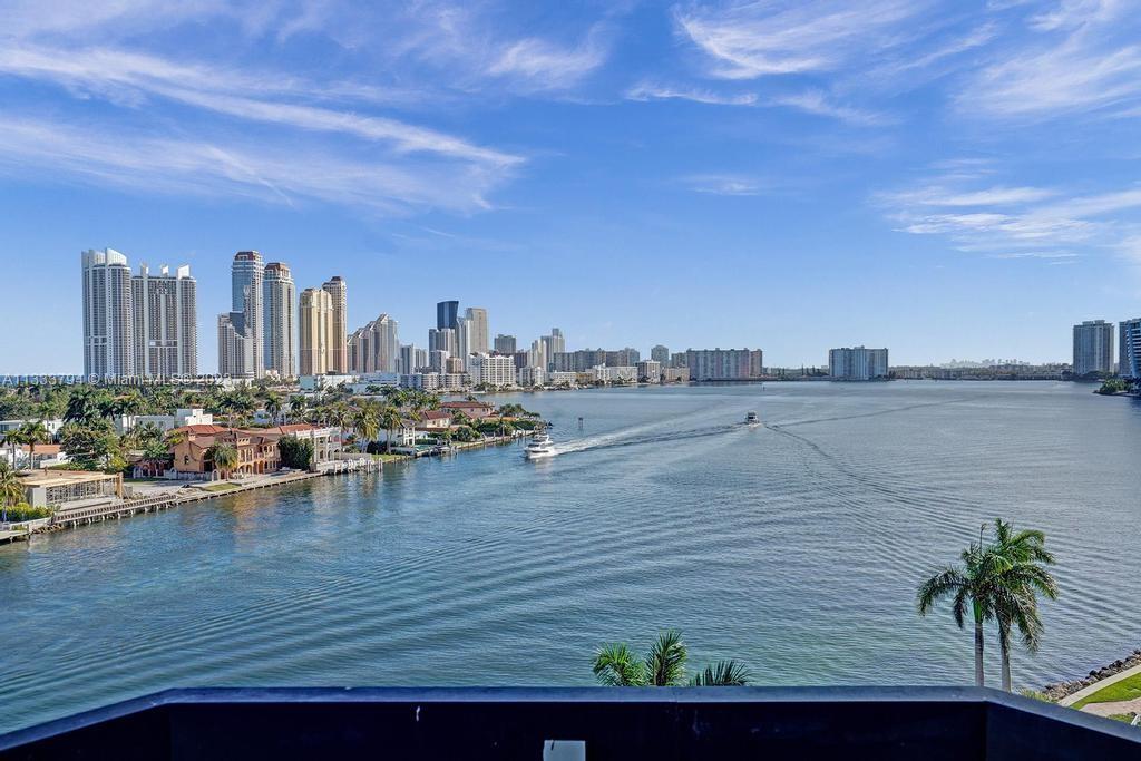 a view of a ocean with tall building