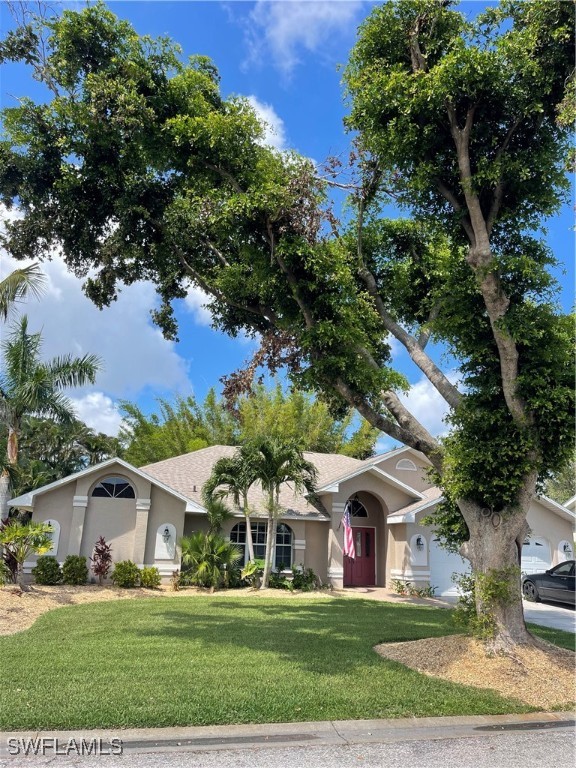 a front view of a house with a yard