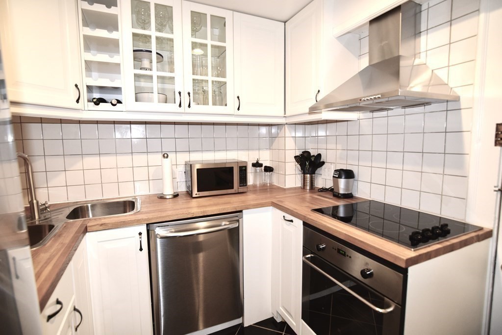 a kitchen with a sink and a stove