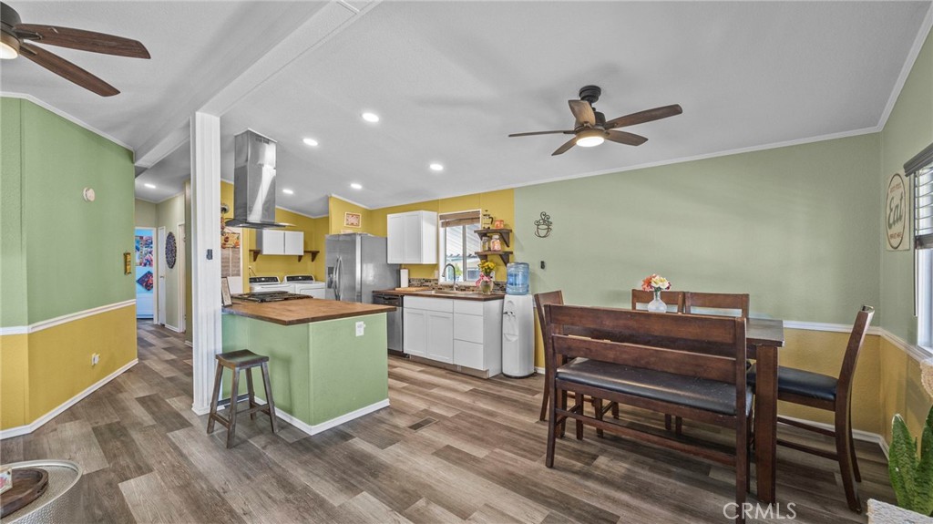 a kitchen with a table and chairs