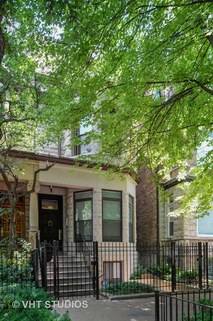 a view of a house with a tree