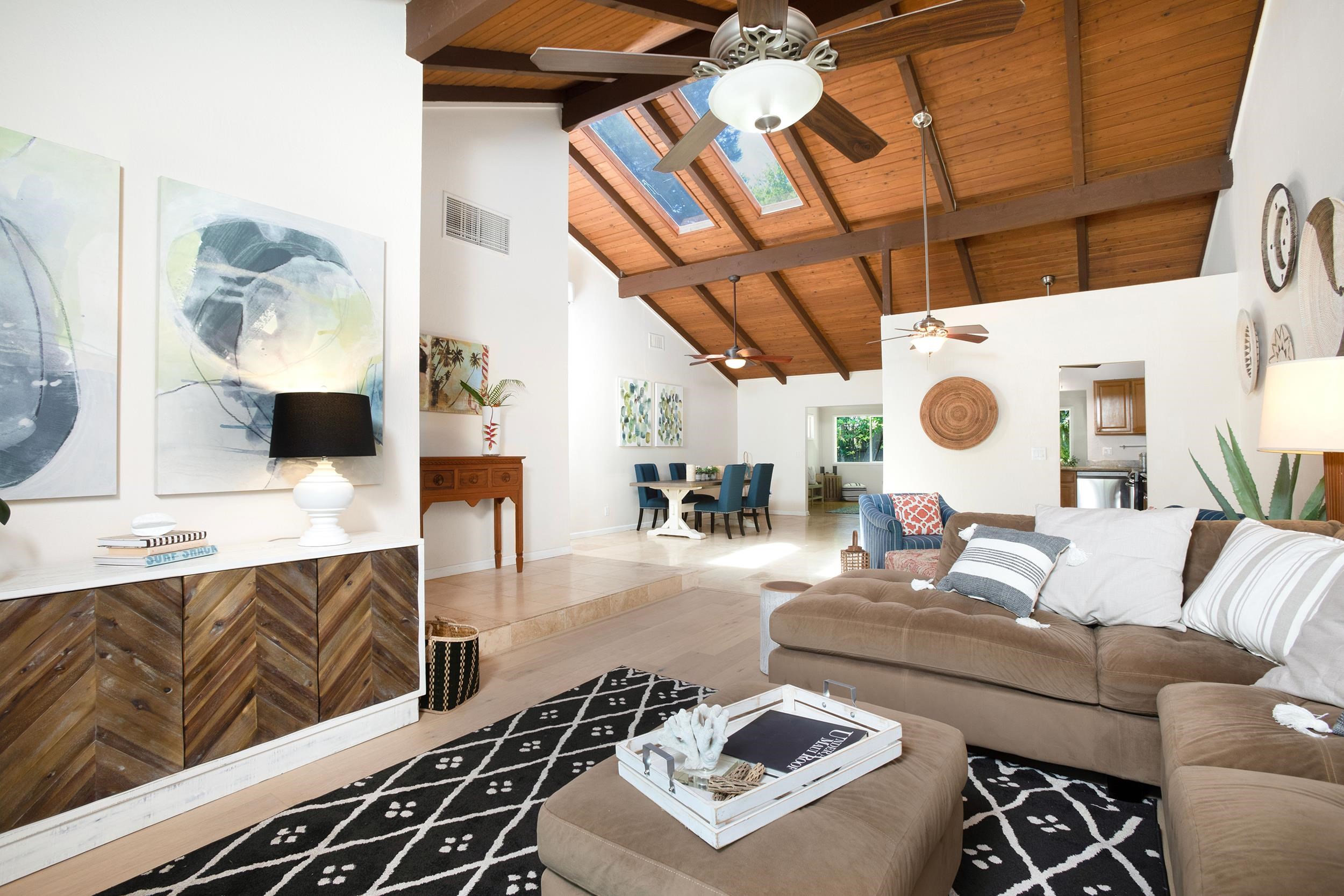 a living room with furniture and a clock