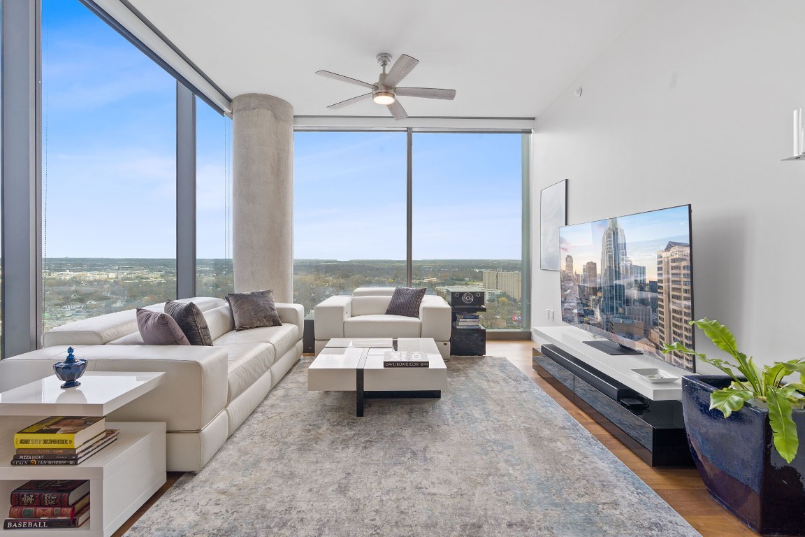 a living room with furniture and a large window