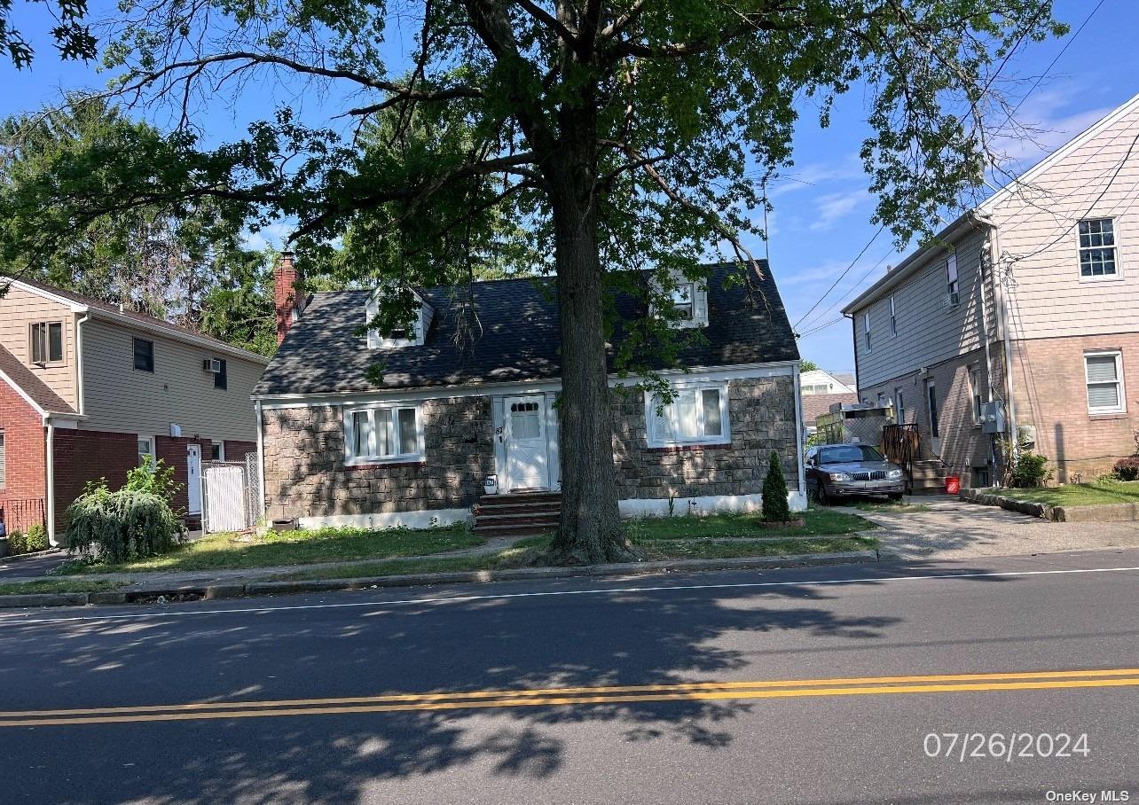 a front view of a building with street view