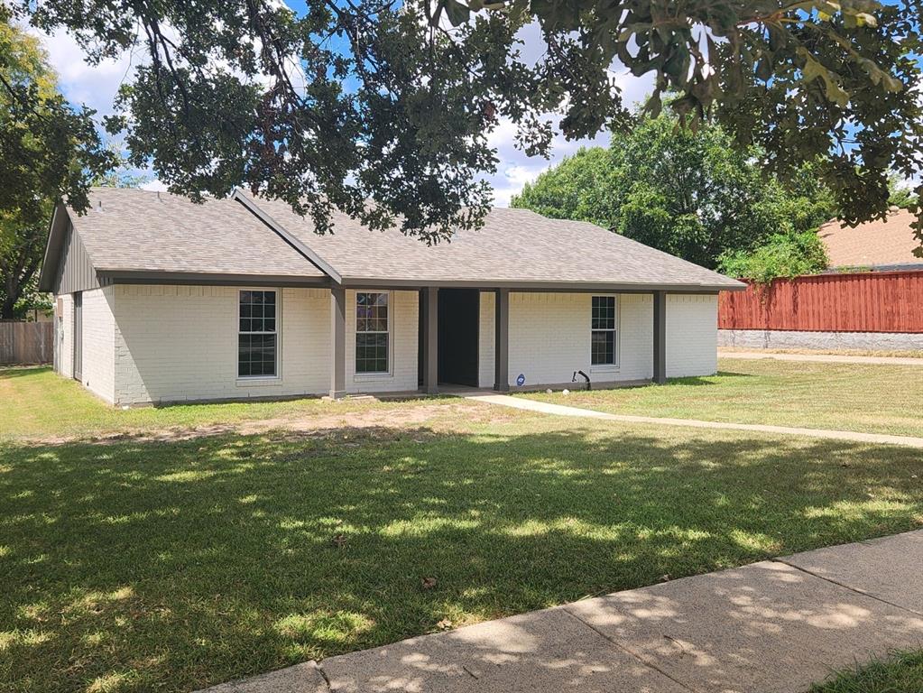 a house with a tree in front of it