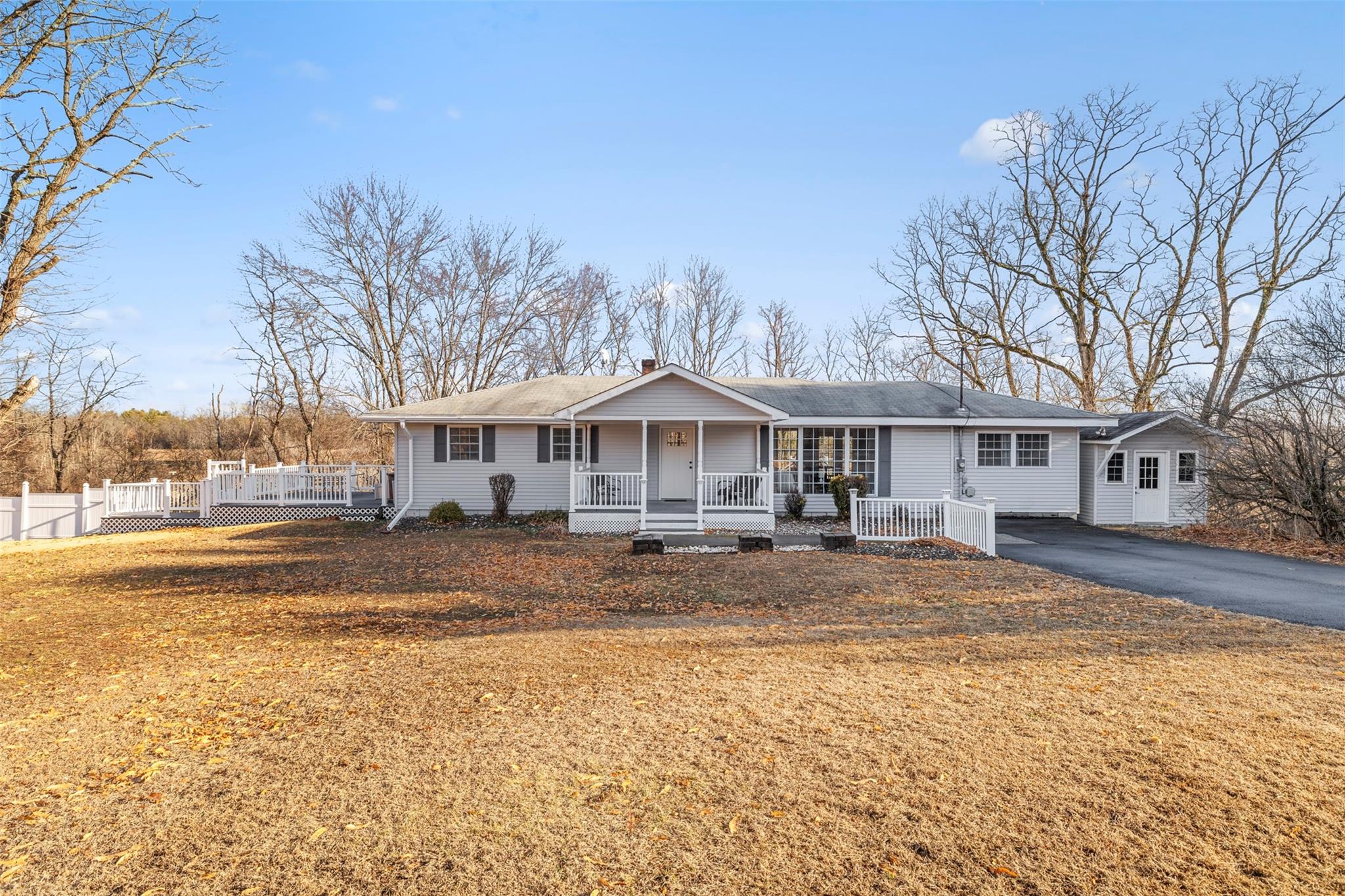 Ranch-style home featuring a porch