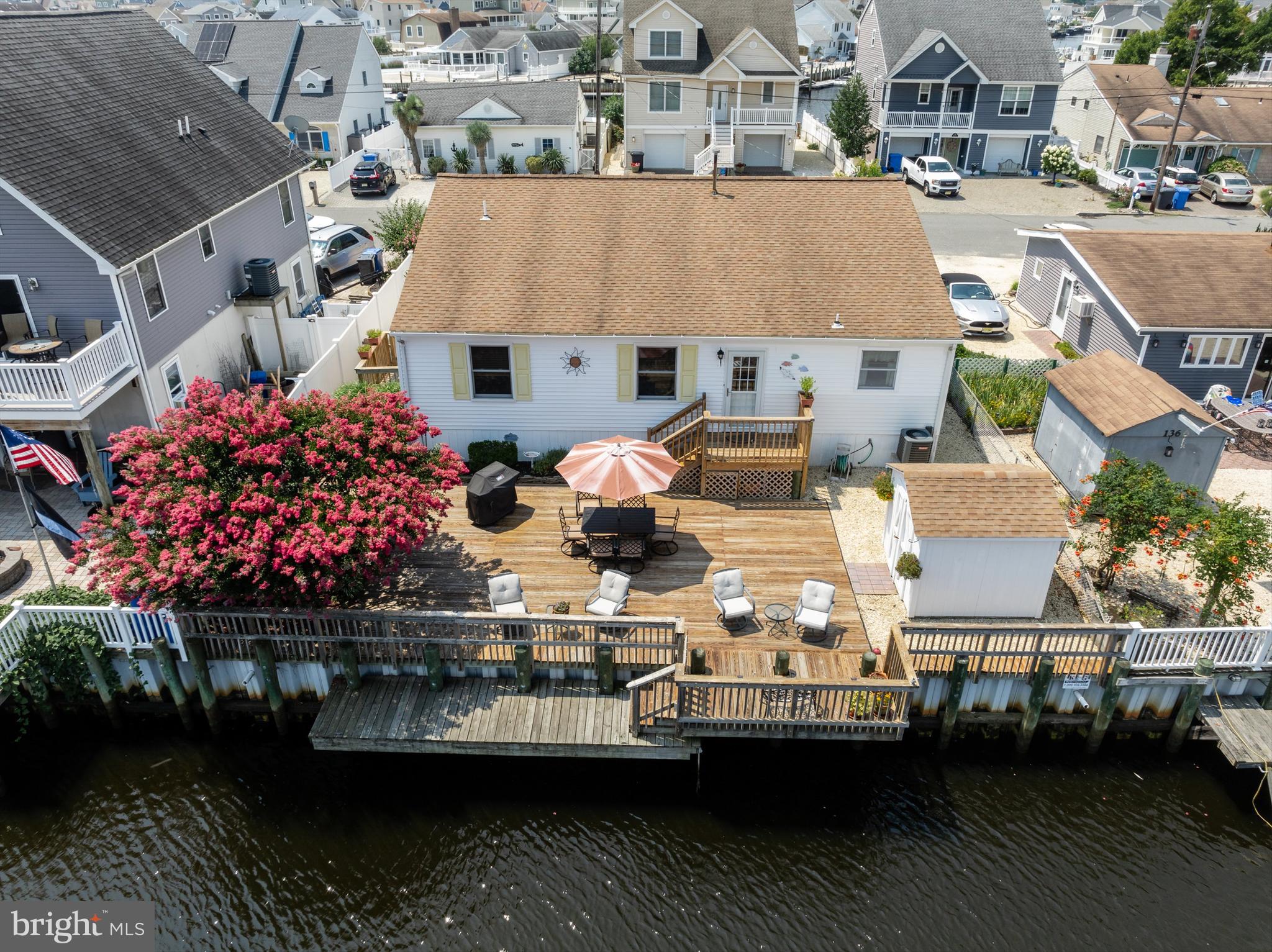 an aerial view of a house with a ocean view