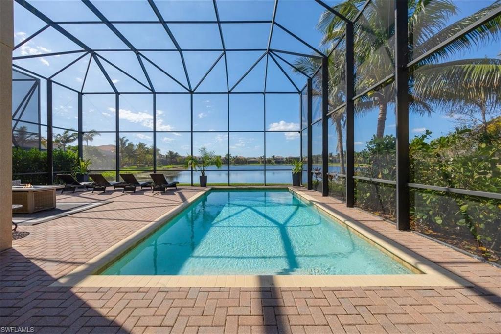 a view of swimming pool with outdoor seating