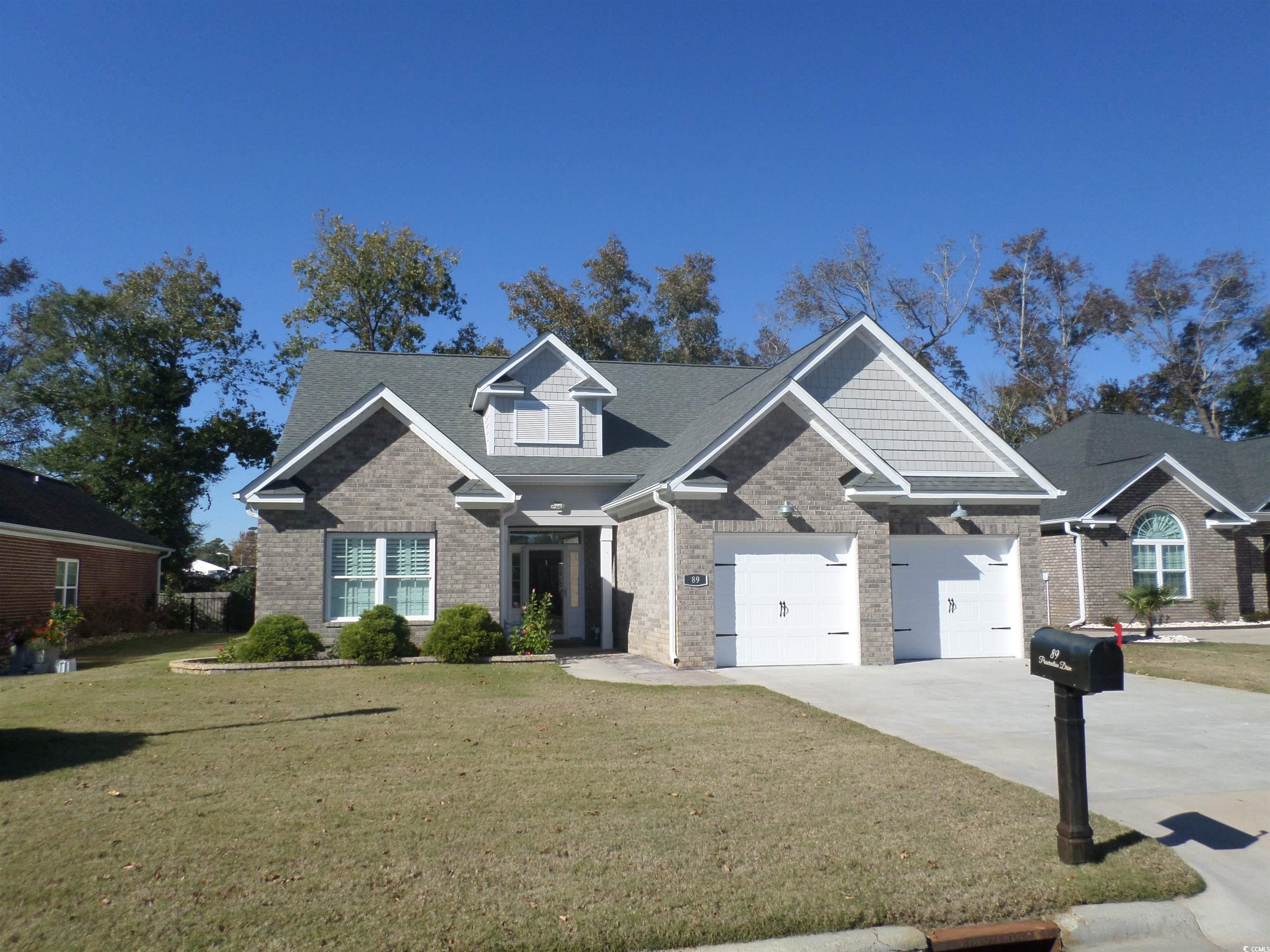 Craftsman-style home featuring a front lawn and a