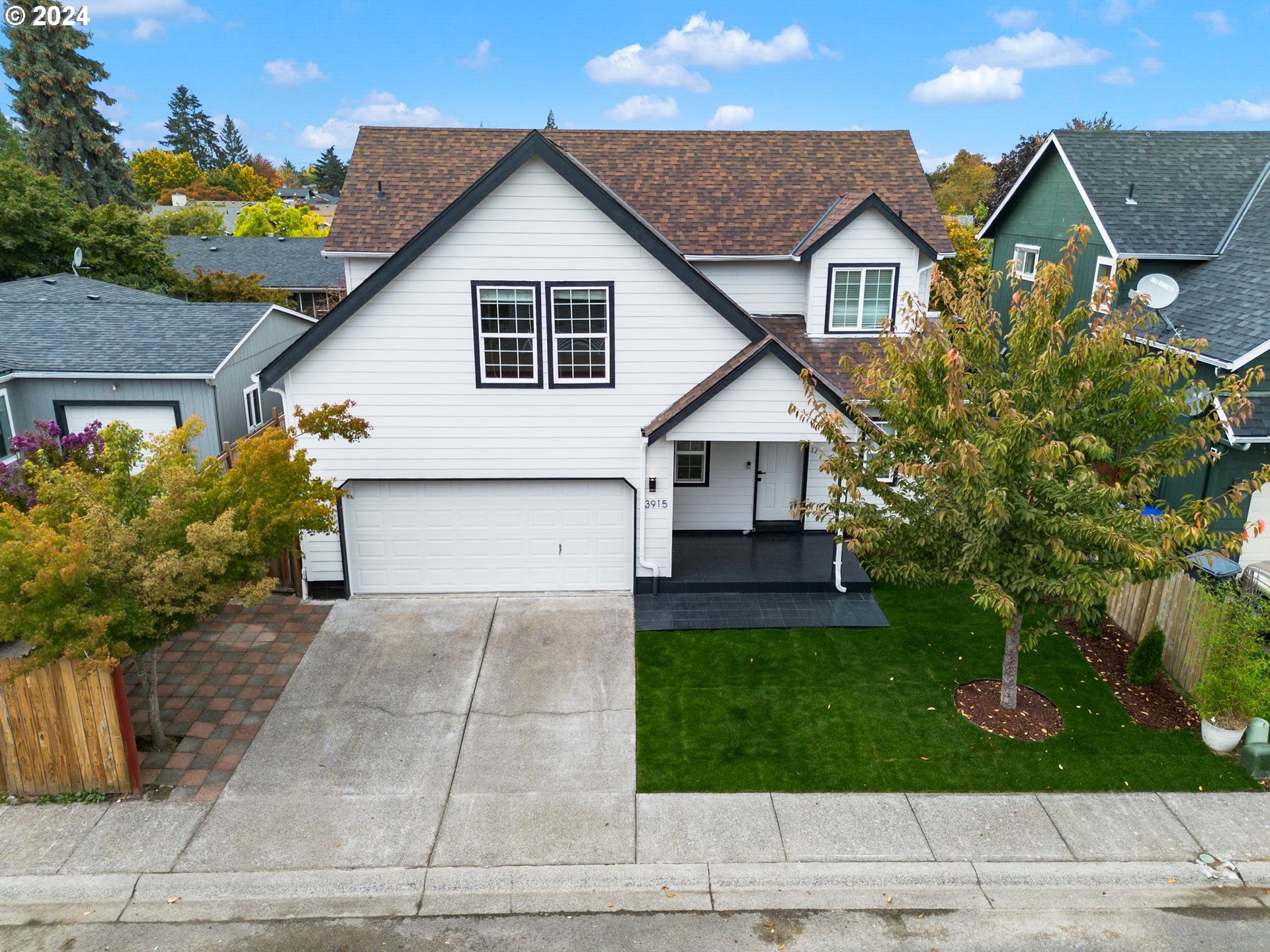 a view of front of house with a yard