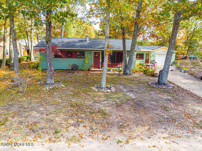 a view of a house with backyard porch and sitting area