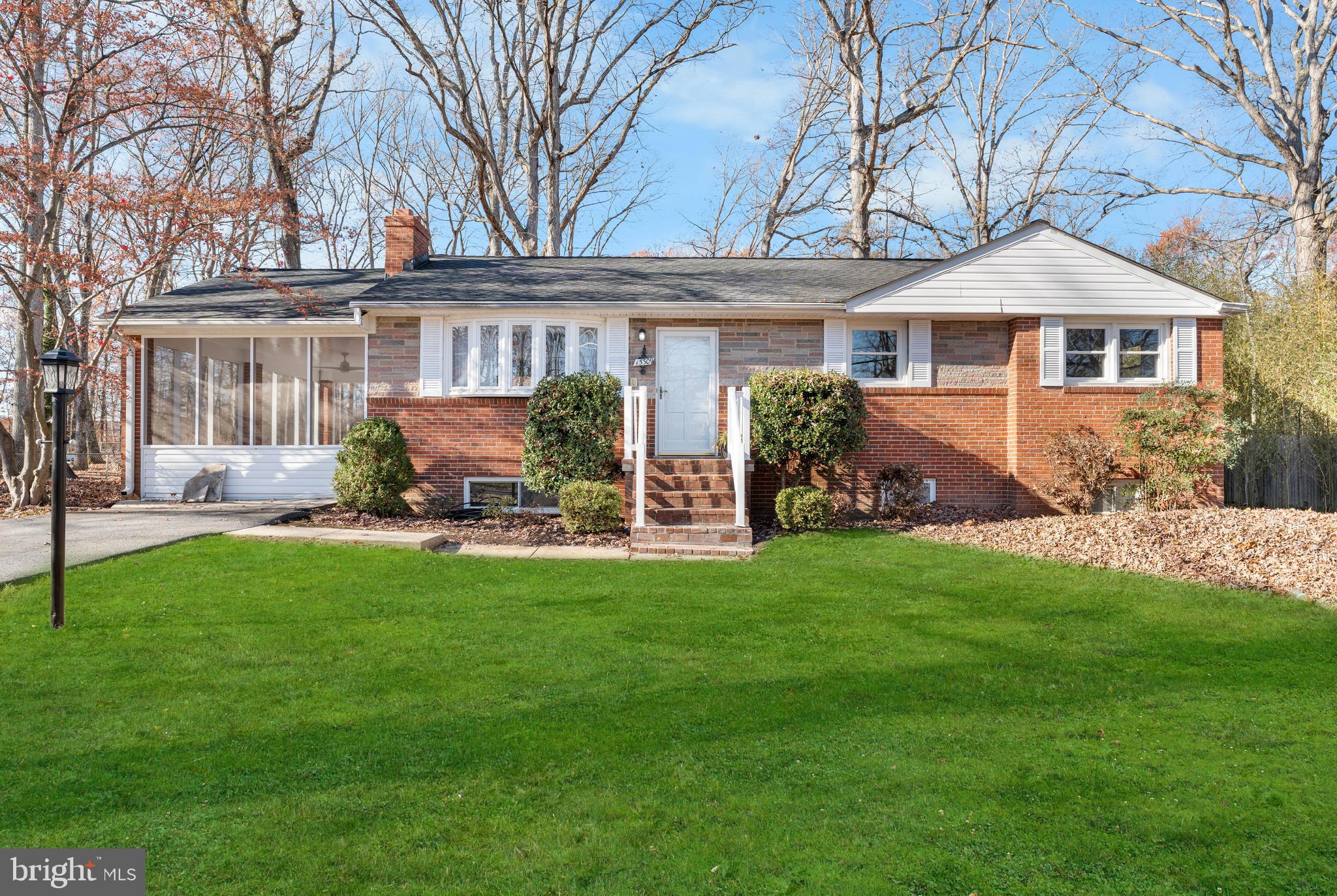 a front view of a house with a garden and porch