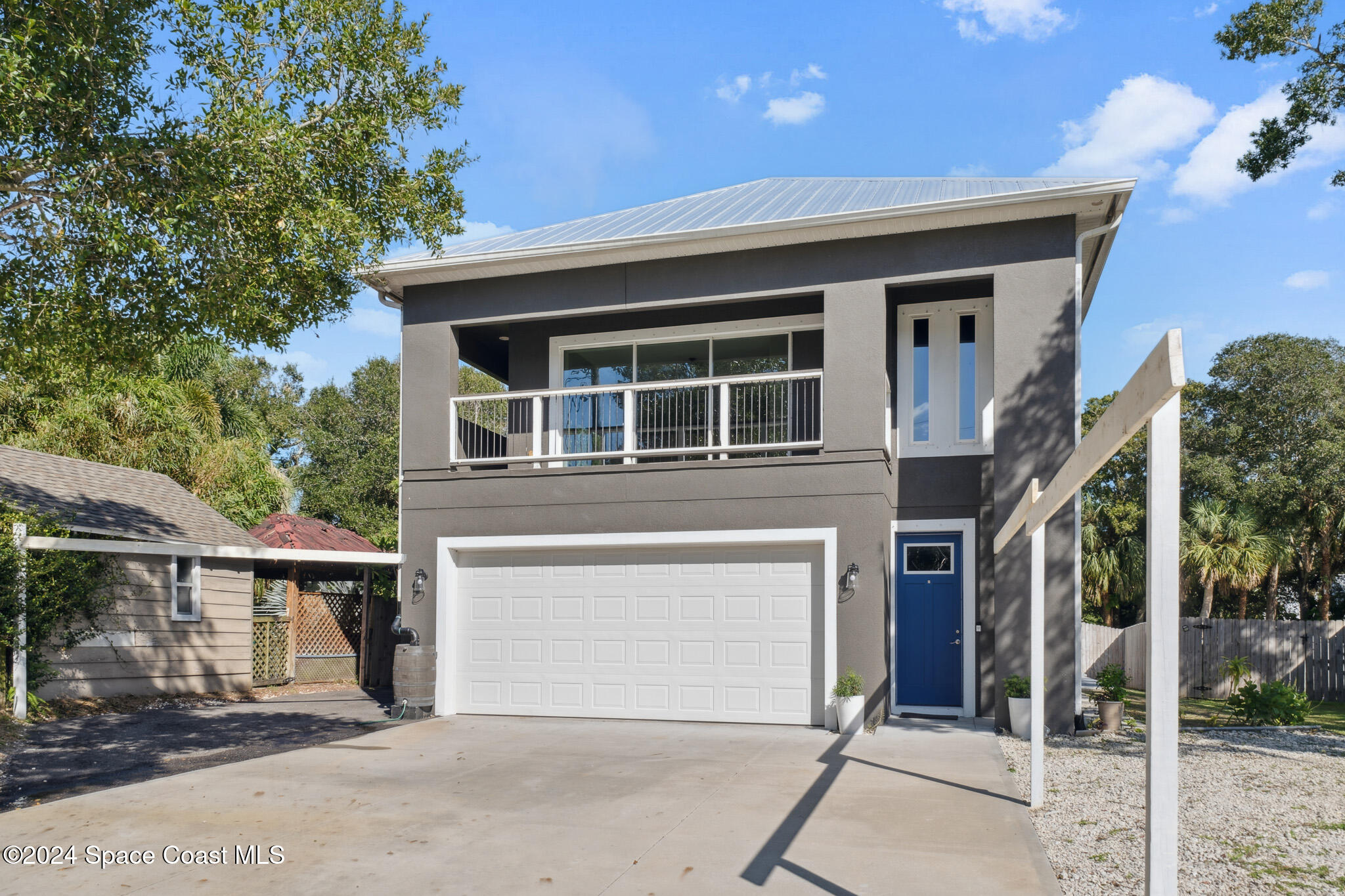 a front view of a house with a garage