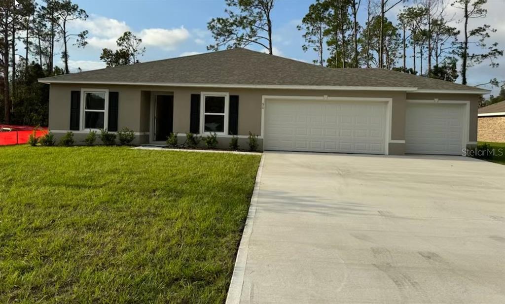 a front view of a house with yard