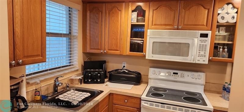 a kitchen with a stove and a microwave