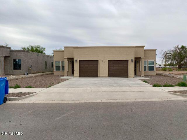 a front view of a house with a garage