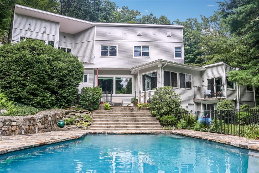 a house with river in front of it