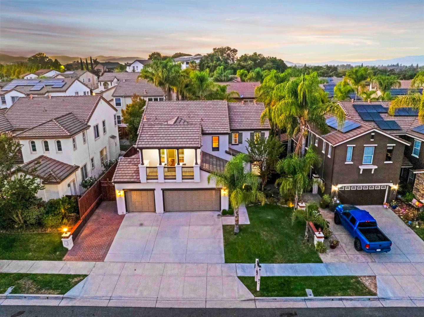 a aerial view of multiple houses with a yard