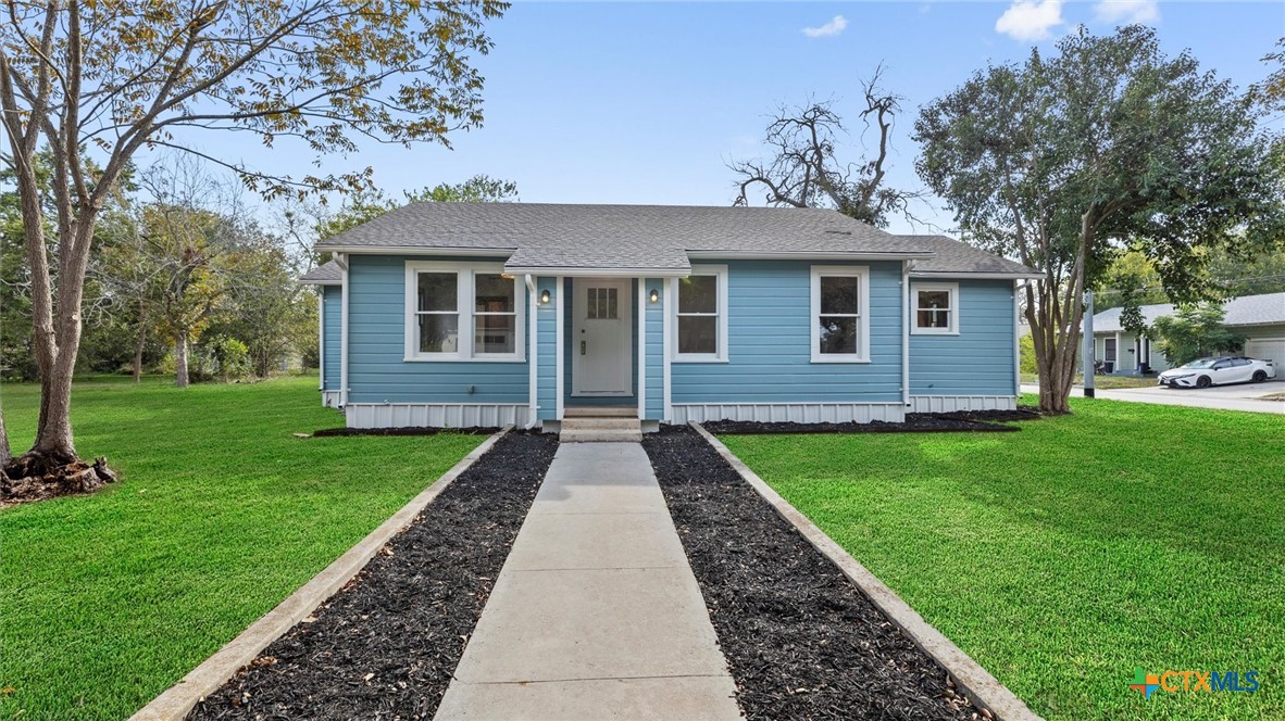 a view of a house with garden