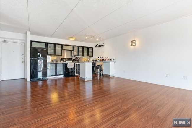 a view of dining room with furniture and wooden floor