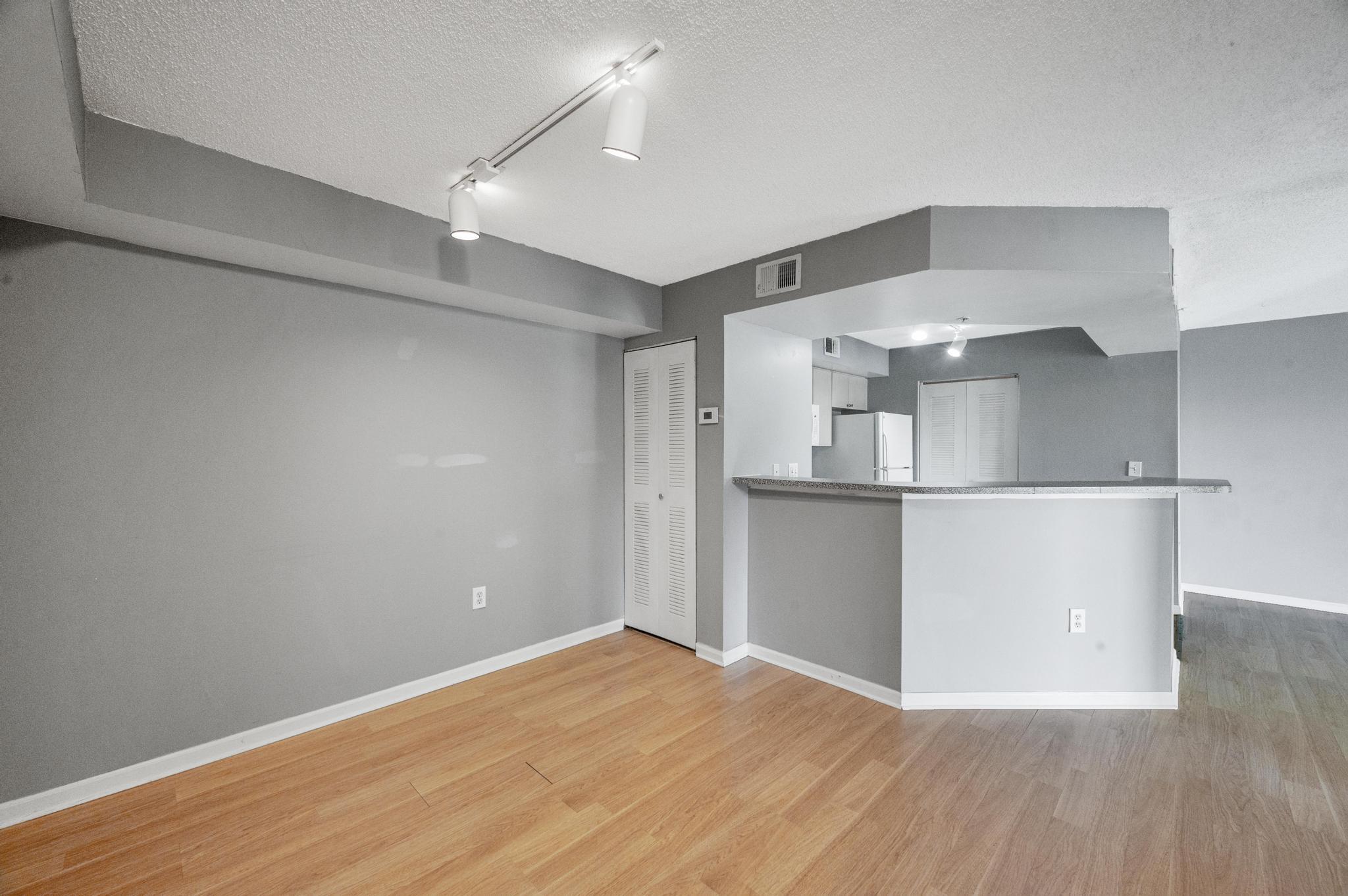 a view of a kitchen with wooden floor