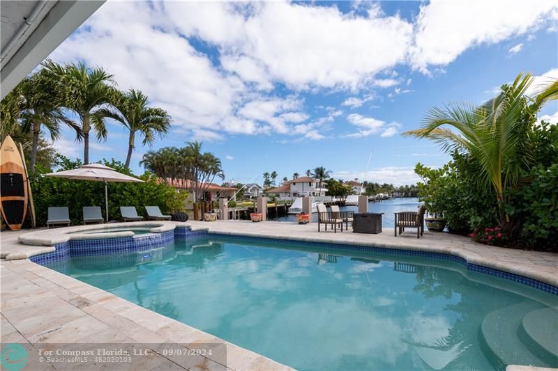 a view of a swimming pool with a patio