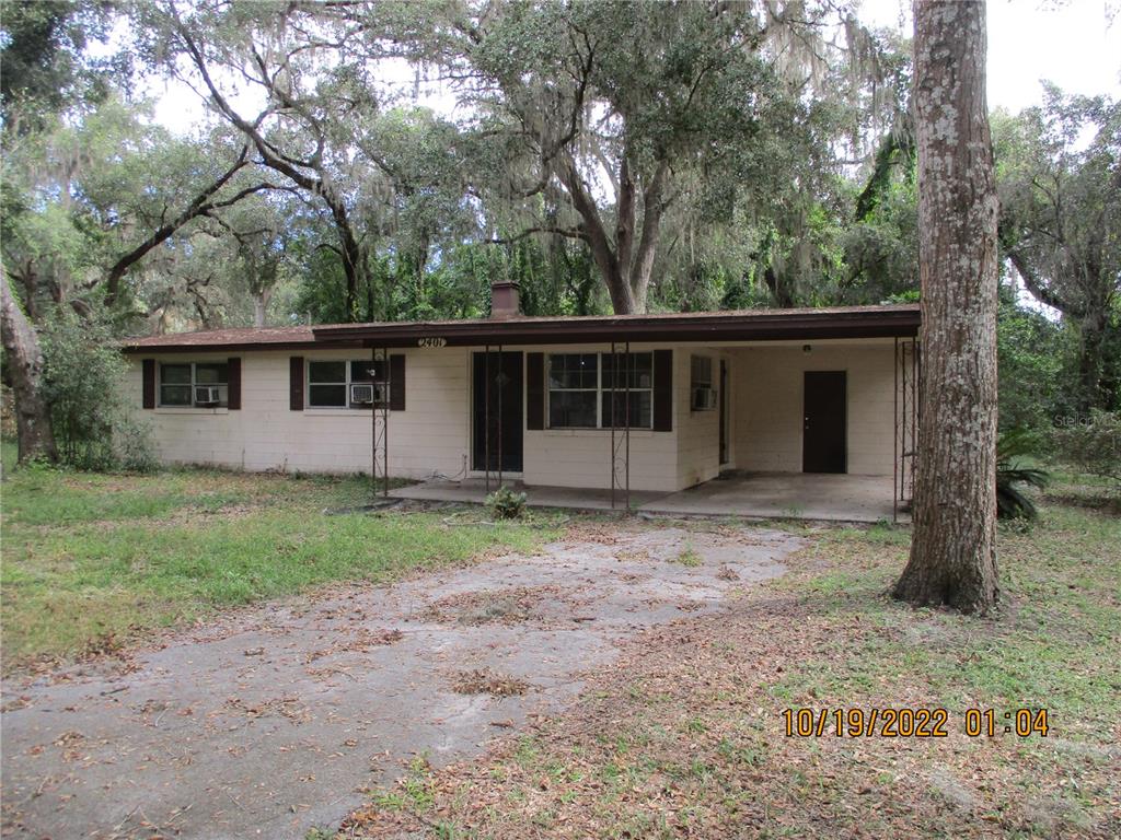 a house with trees in the background