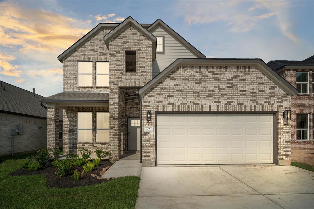 Welcome home to 1923 Scarlet Yaupon Way located in Barton Creek Ranch and zoned to Conroe ISD.