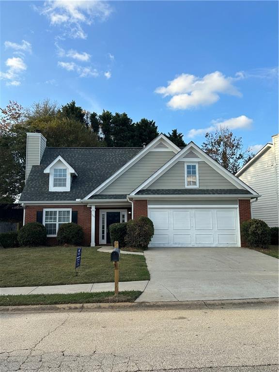 front view of a house with a yard