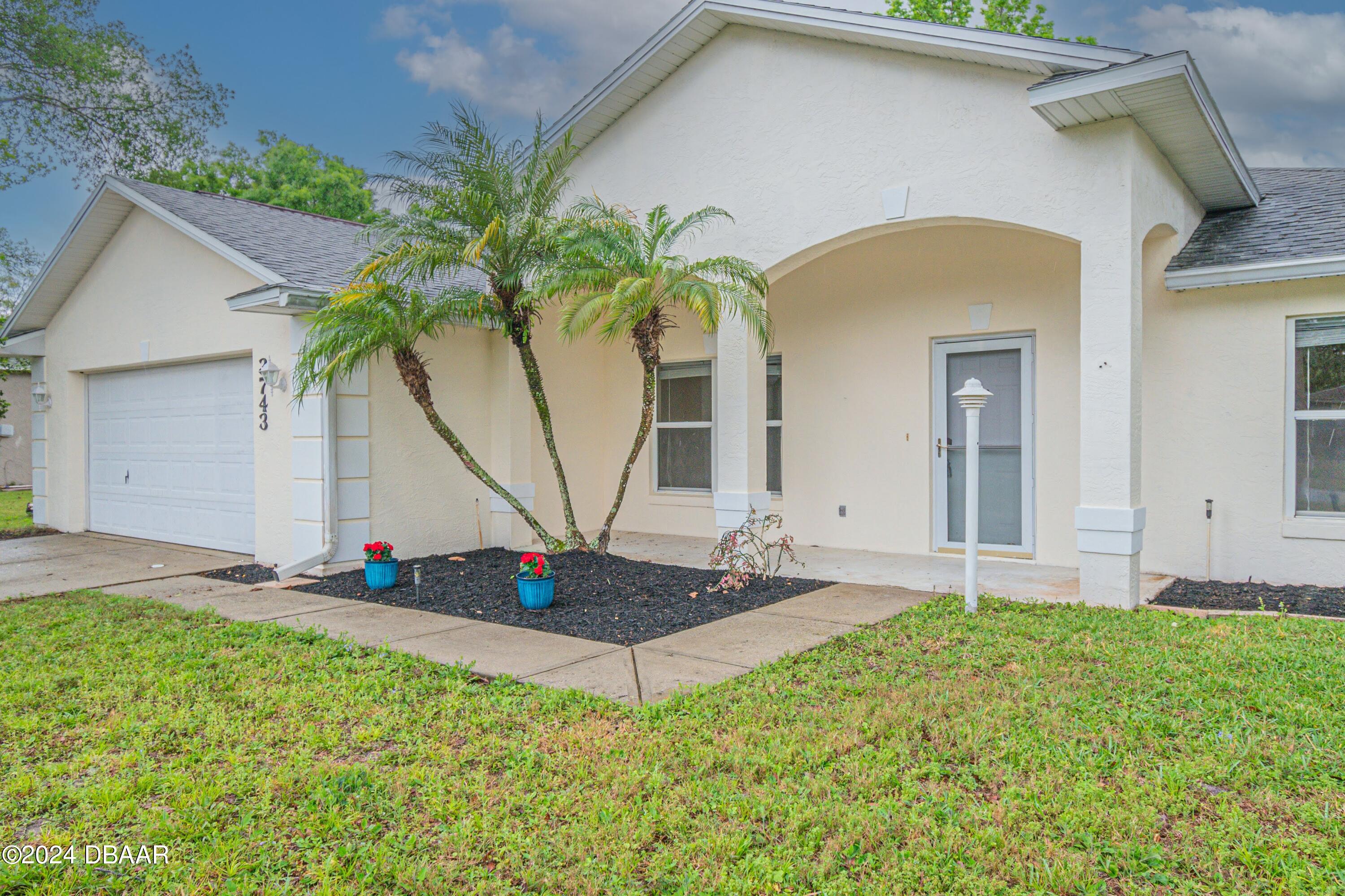 a front view of house with yard