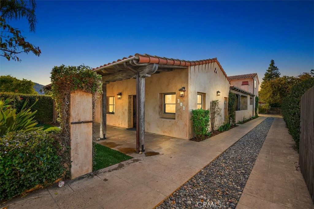 a front view of a house with yard